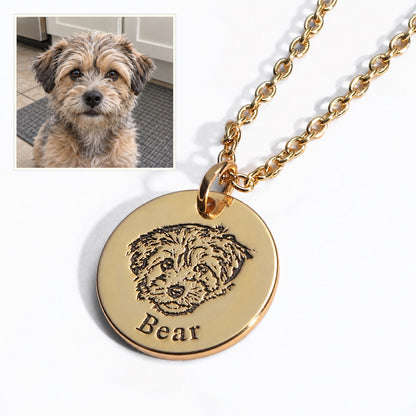 Dog — AI concept: casual indoor phone snapshot of Bear above a gold engraved portrait necklace. Illustrative pet photo, not the original source photo.