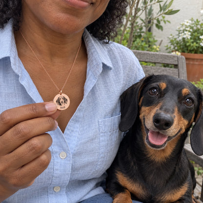 Dog — AI concept: Rose Gold Nell black-and-tan dachshund worn portrait necklace — not a customer photo or verified finished product.